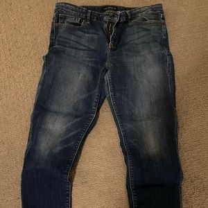 Lucky Brand stretch skinny jean with slight fray at bottom of legs.